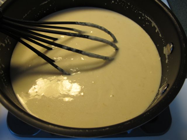 Stir the milk and cheese mixture.