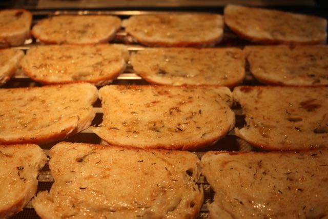 Brush bread with oil mixture.