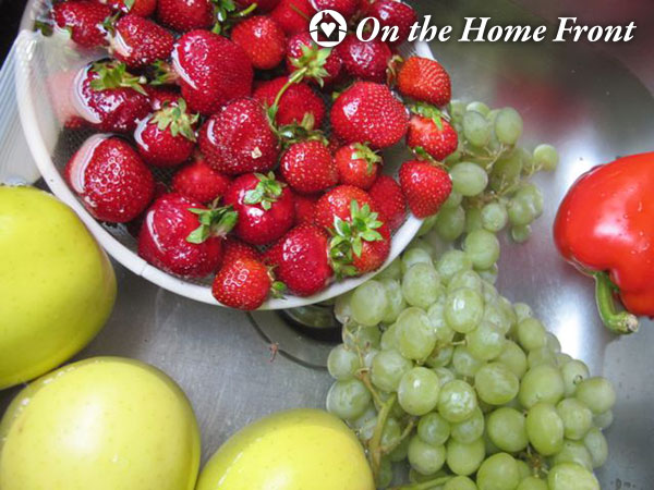Add fruit and vegetables to the sink.