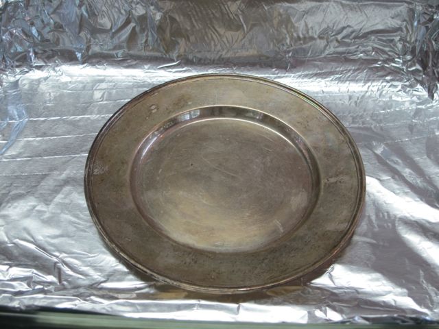 Place silver on aluminum foil.