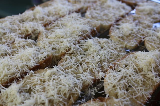 Sprinkle bread with cheese.