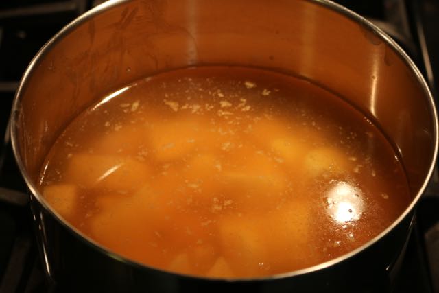 Boil potatoes in stock.