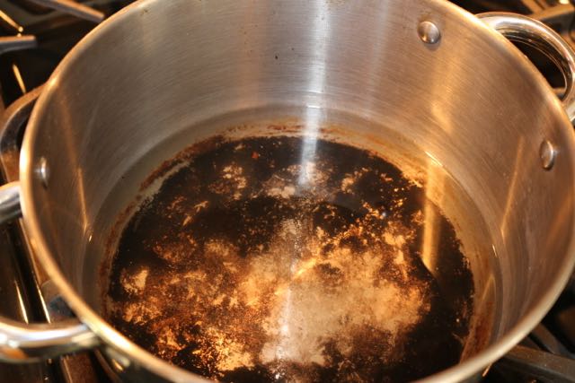 Soak the pot in vinegar and water