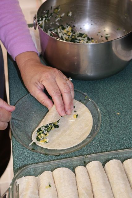 Filling the tortillas.