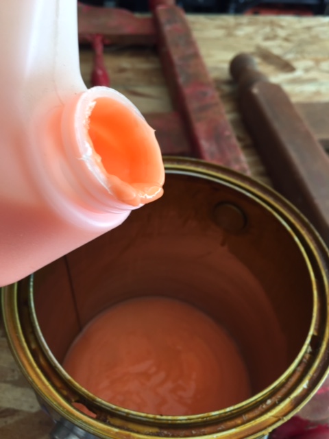 Pour stripper into a smaller container.