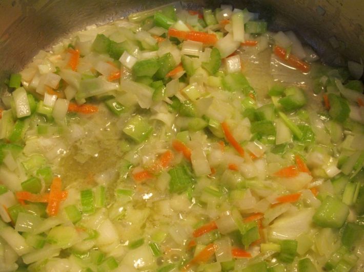 Simmer vegetables in wine.