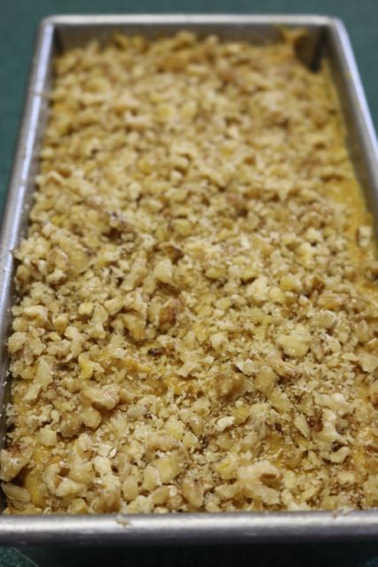 Top batter with chopped nuts.