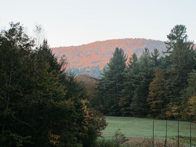 The early morning sun lights up the mountains.
