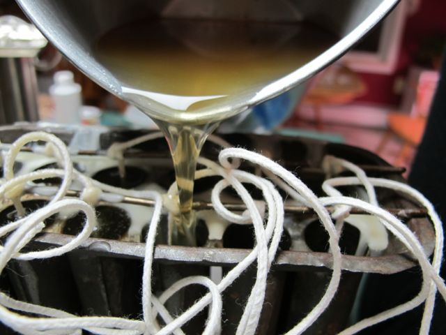 Carefully pour the melted wax into the mold.