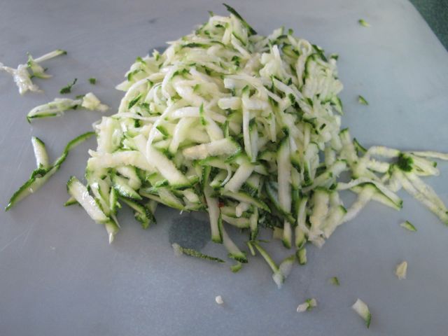 Shred zucchini and squeeze dry