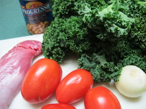 kale, tomatoes, beans, onions, pork