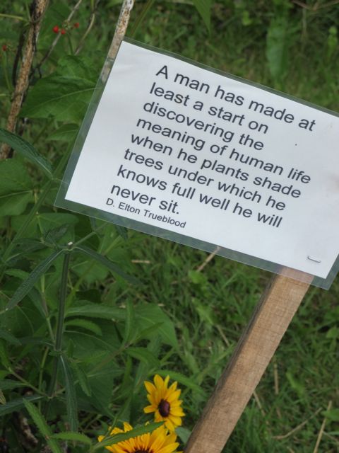 Garden related quotes line the garden paths.