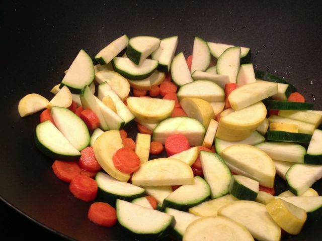 Add zucchini and continue to sauté vegetables.