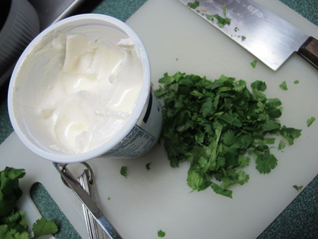 Combine cilantro and sour cream.